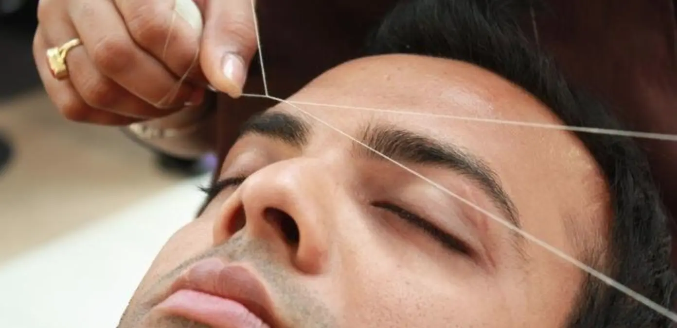Expert male eyebrow threading and precision grooming at Meena Beauty Salon